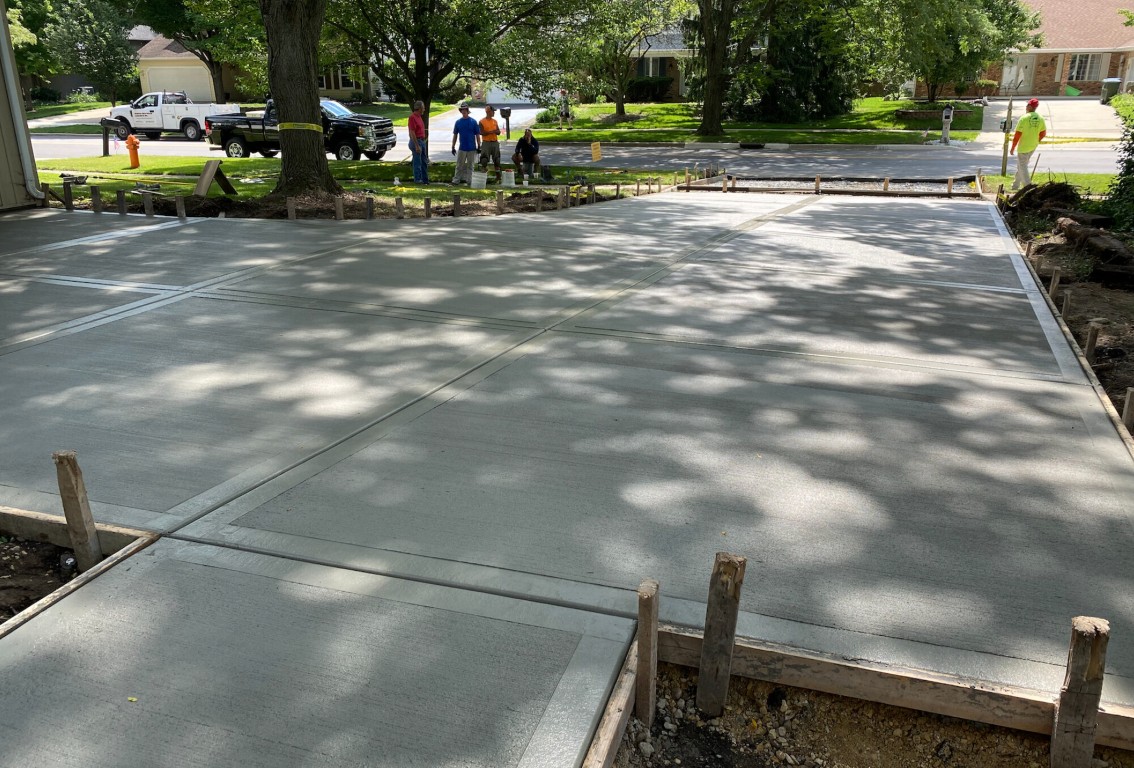 Professional concrete driveway installation crew working in Laredo, TX