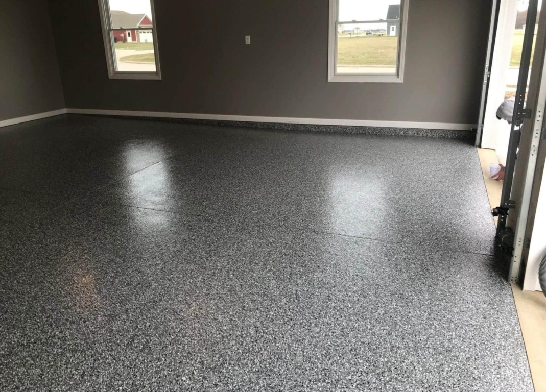 Professionally coated epoxy garage floor with gray speckle finish in Laredo, TX