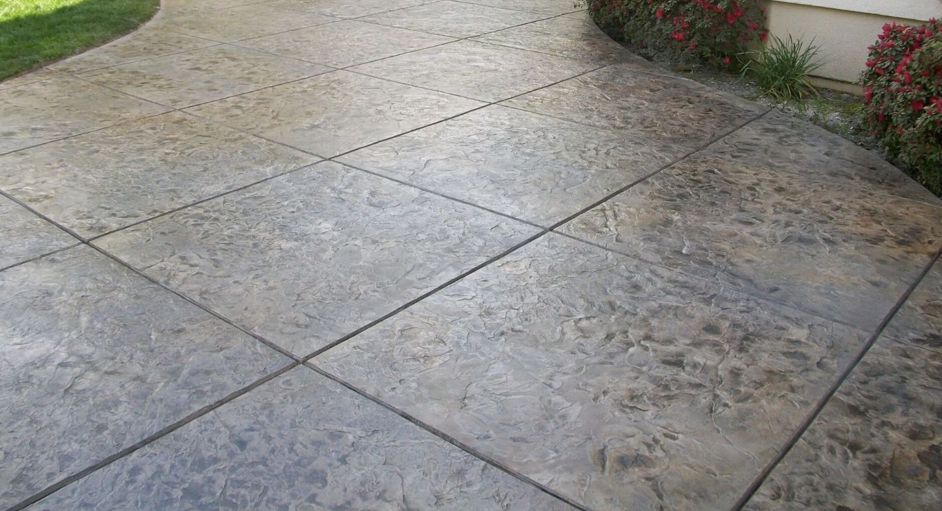 Stamped concrete patio with realistic stone tile pattern in Laredo, TX